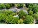 Aerial view showcases community buildings, pool, parking, and mature trees, creating a tranquil atmosphere at 302 Northwest Dr, Davidson, NC 28036