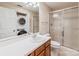 Functional bathroom with modern sink and shower stall, plus stacked washer and dryer for added convenience at 302 Northwest Dr, Davidson, NC 28036