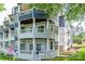 Condo exterior featuring multiple balconies with white railings, showcasing outdoor living spaces at 302 Northwest Dr, Davidson, NC 28036