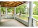 Charming covered porch with white columns and railing, providing a relaxing outdoor space at 302 Northwest Dr, Davidson, NC 28036
