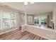 Bright living room featuring wood floors and fireplace, perfect for relaxing or entertaining guests at 302 Northwest Dr, Davidson, NC 28036