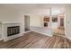 Living room features wood floors, fireplace and is open to the kitchen, making it ideal for entertaining at 302 Northwest Dr, Davidson, NC 28036
