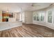 Living room features wood floors and is open to the kitchen, making it ideal for entertaining at 302 Northwest Dr, Davidson, NC 28036
