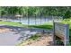Community amenity featuring tennis courts with manicured landscaping and a covered gazebo at 302 Northwest Dr, Davidson, NC 28036