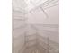 Walk-in closet with built-in white wire shelving on all walls at 302 Northwest Dr, Davidson, NC 28036