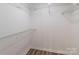 Spacious walk-in closet featuring ample shelving and modern flooring for optimal storage and organization at 302 Northwest Dr, Davidson, NC 28036