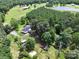 Aerial view showcasing a house nestled among trees, with vast green land surrounding it at 4636 Brown Creek Church Rd, Wadesboro, NC 28170