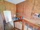 Unfinished basement with a staircase and wooden shelving at 4636 Brown Creek Church Rd, Wadesboro, NC 28170