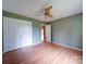 Bedroom featuring hardwood floors, a ceiling fan, and a large closet with doors at 4636 Brown Creek Church Rd, Wadesboro, NC 28170