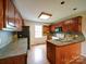Well-lit kitchen showcasing wood cabinetry, stainless sink, and practical layout at 4636 Brown Creek Church Rd, Wadesboro, NC 28170
