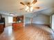 Open floor plan with wood floors, fan lighting, and a view of the kitchen area at 4636 Brown Creek Church Rd, Wadesboro, NC 28170