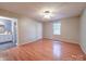 Inviting bedroom with wood-look flooring, ceiling fan, and bathroom access at 4636 Brown Creek Church Rd, Wadesboro, NC 28170