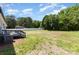 A spacious backyard with a deck and an air conditioning unit, offering plenty of room and outdoor comfort at 4750 Enochville Rd, Kannapolis, NC 28081
