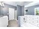Bathroom with double vanity, white subway tile, a tub, and a separate shower at 4750 Enochville Rd, Kannapolis, NC 28081