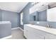 Bathroom featuring a double sink vanity with white cabinets and light gray walls at 4750 Enochville Rd, Kannapolis, NC 28081