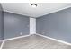 This bedroom has grey walls, white trim and light gray flooring at 4750 Enochville Rd, Kannapolis, NC 28081