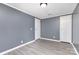 This bedroom has grey walls, white trim and two doors at 4750 Enochville Rd, Kannapolis, NC 28081