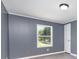 A bright bedroom features a window and white trim at 4750 Enochville Rd, Kannapolis, NC 28081