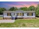 Charming single-story home with a well-manicured lawn and inviting front porch at 4750 Enochville Rd, Kannapolis, NC 28081