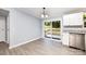 Kitchen-dining area with stainless steel appliances, white cabinets, and access to deck at 4750 Enochville Rd, Kannapolis, NC 28081