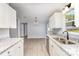 Well-lit kitchen featuring stainless appliances, granite countertops, and modern lighting at 4750 Enochville Rd, Kannapolis, NC 28081