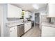 Modern kitchen features stainless steel appliances, granite countertops, and white cabinets at 4750 Enochville Rd, Kannapolis, NC 28081
