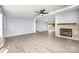 Bright and open living area with a stone fireplace and a view to the outdoor patio at 4750 Enochville Rd, Kannapolis, NC 28081