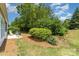 Green backyard featuring a concrete patio with chairs and lush foliage provides a private retreat at 5141 Grandview Dr, Fort Mill, SC 29707