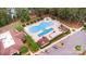 Aerial view of an outdoor pool with lounge chairs in a well-maintained community at 5141 Grandview Dr, Fort Mill, SC 29707