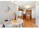 Bright dining area open to the kitchen, featuring wood floors, and a large window at 5141 Grandview Dr, Fort Mill, SC 29707