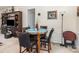 Dining area with a round table and four upholstered chairs, next to a hallway entrance at 5141 Grandview Dr, Fort Mill, SC 29707