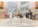 Close-up of kitchen sink, highlighting the stainless steel faucet and window with blinds at 5141 Grandview Dr, Fort Mill, SC 29707