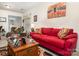 Inviting living room featuring a bright red sofa and a decorative area rug at 5141 Grandview Dr, Fort Mill, SC 29707