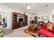 Spacious living room featuring a large entertainment center, ceiling fan, and open layout at 5141 Grandview Dr, Fort Mill, SC 29707