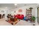 Cozy living room with a bright red sofa, area rug, and lots of natural light at 5141 Grandview Dr, Fort Mill, SC 29707