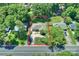 Aerial shot showcases the property with a well-maintained yard and mature trees at 532 Scaleybark Rd, Charlotte, NC 28209