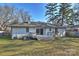 A bright back exterior features a small deck off the sliding glass doors at 532 Scaleybark Rd, Charlotte, NC 28209