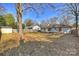 Large backyard features a storage shed, privacy fence, and a lovely deck for entertaining at 532 Scaleybark Rd, Charlotte, NC 28209