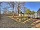 Spacious backyard with wooden deck and privacy fence offers plenty of room for outdoor activities at 532 Scaleybark Rd, Charlotte, NC 28209