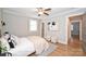 Comfortable bedroom with hardwood floors, a ceiling fan, neutral paint, and bright natural light at 532 Scaleybark Rd, Charlotte, NC 28209