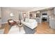 Bright living room featuring hardwood floors, stylish furniture, and an open layout to the kitchen at 532 Scaleybark Rd, Charlotte, NC 28209
