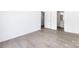 Bright bedroom with neutral walls, hard flooring and view into bathroom at 5343 Esther Ln, Charlotte, NC 28214