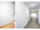 Bright hallway with staircase and laminate flooring leading to other rooms at 5343 Esther Ln, Charlotte, NC 28214