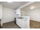 Open kitchen with white cabinetry, stainless steel appliances, and sleek countertops at 5343 Esther Ln, Charlotte, NC 28214
