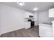 Modern kitchen with white cabinetry, updated appliances, and sleek countertops at 5343 Esther Ln, Charlotte, NC 28214