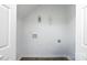 Room with white walls and flooring and containing several utility hook-ups at 5343 Esther Ln, Charlotte, NC 28214