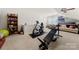 Bright bonus room featuring home gym, neutral walls and carpet, with a built-in bookshelf and ample lighting at 5428 Colonial Garden Dr, Huntersville, NC 28078