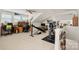Spacious bonus room with vaulted ceilings, a ceiling fan, and dedicated areas for both work and exercise at 5428 Colonial Garden Dr, Huntersville, NC 28078