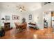 Dining area featuring hardwood floors and stylish furnishings, adjacent to kitchen appliances at 5428 Colonial Garden Dr, Huntersville, NC 28078