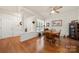 Bright dining area featuring hardwood floors, a ceiling fan, and a large window with natural light at 5428 Colonial Garden Dr, Huntersville, NC 28078